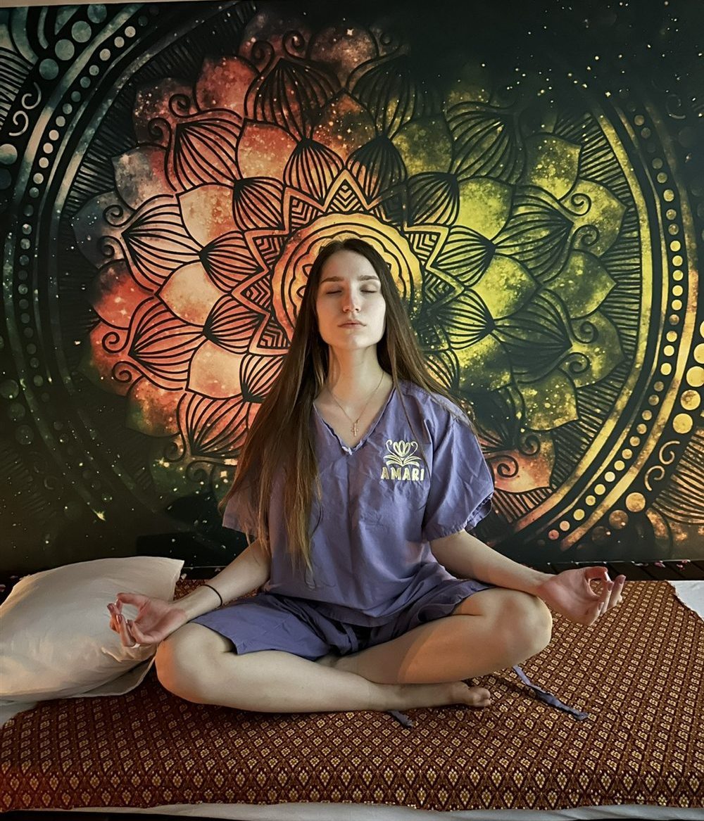 One of the twin sisters meditating